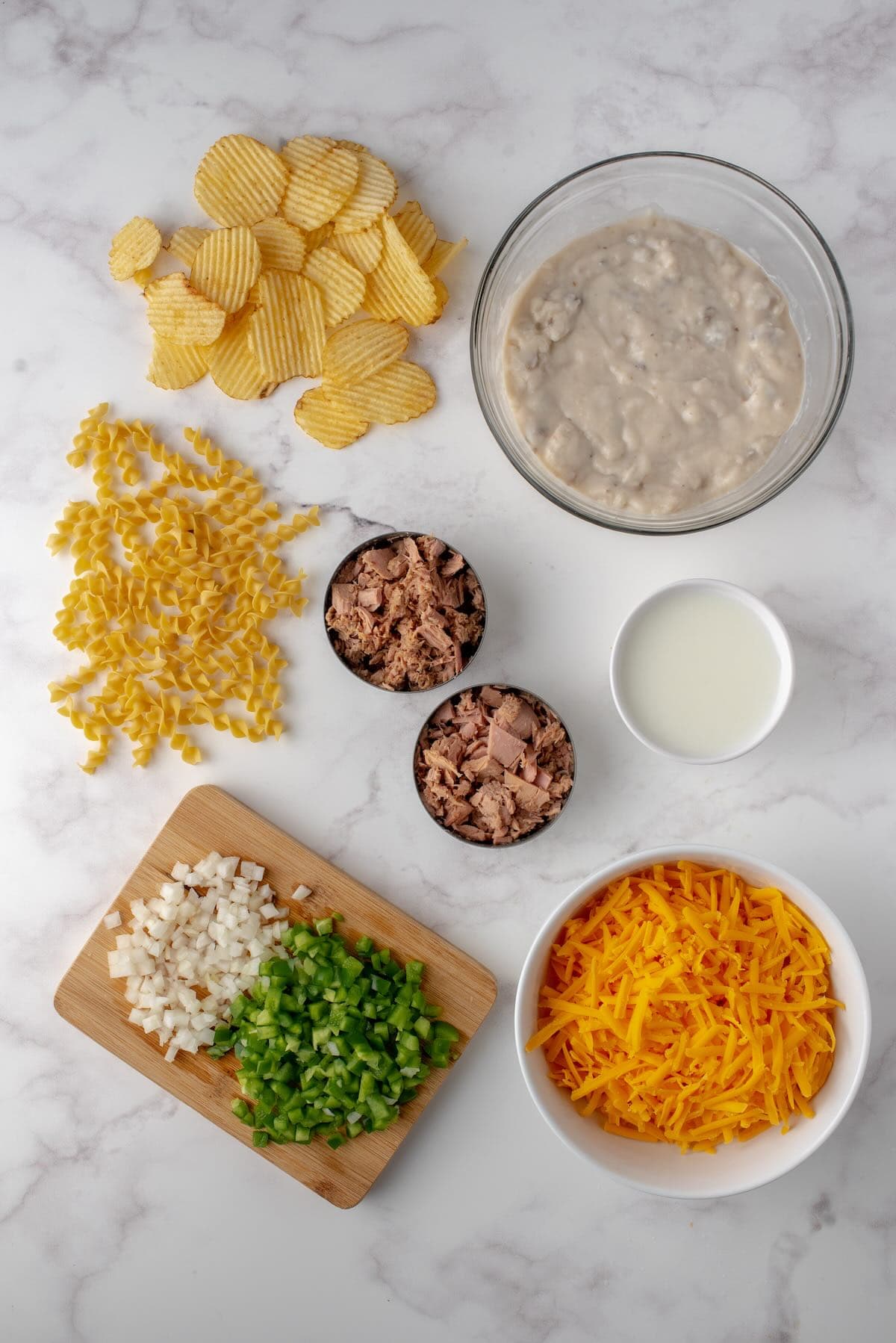 Ingredients to make an easy tuna noodle casserole with cream of mushroom soup.