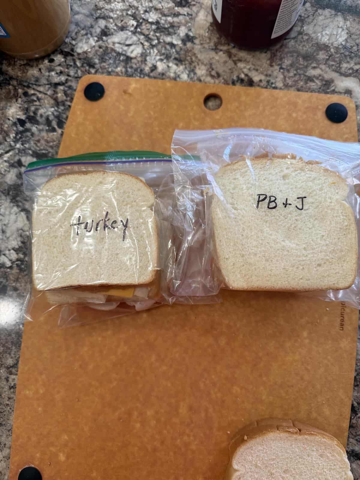 A stack of sandwiches for freezing.