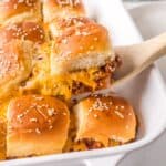 Serving sloppy joe sliders out of a pan.