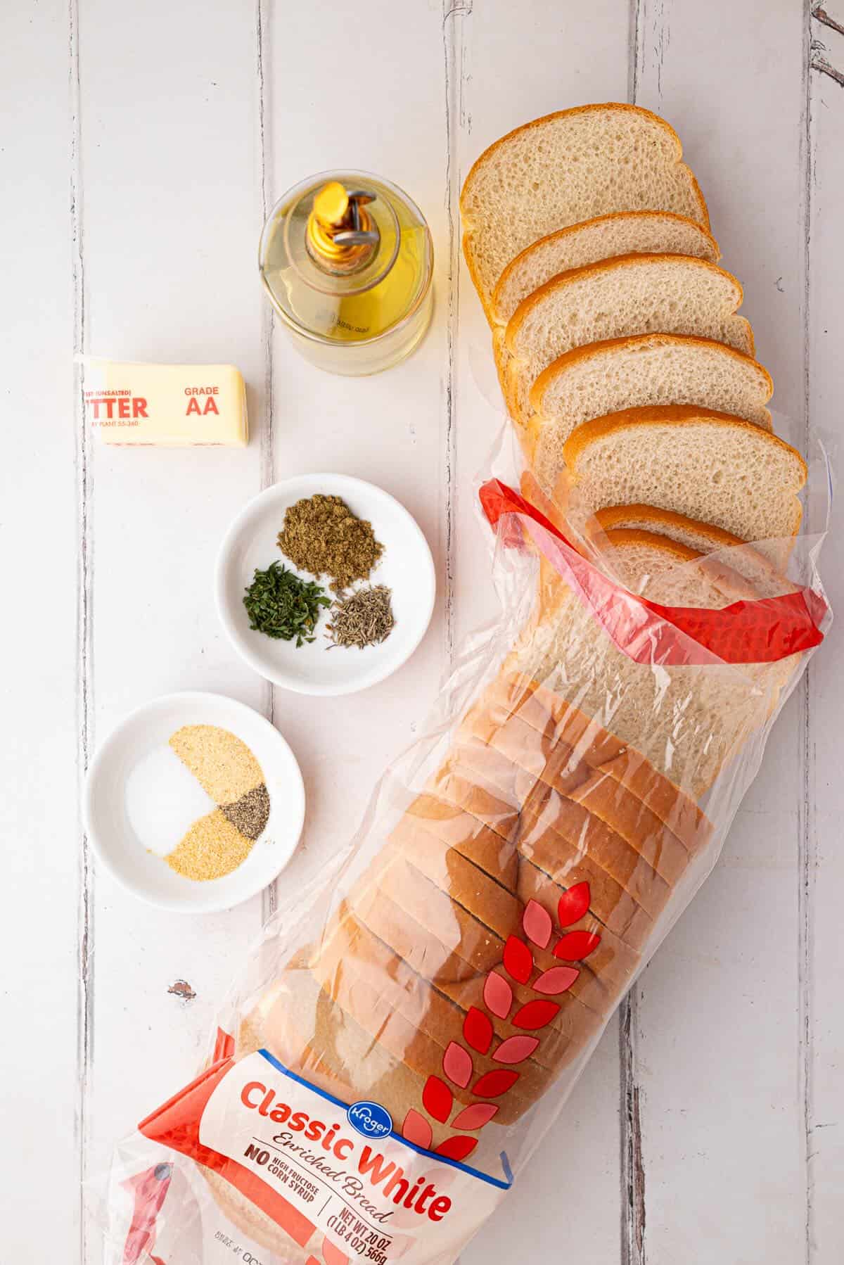 Bread, olive oil, butter and seasonings to make croutons for Thanksgiving stuffing.