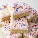 Close-up of soft and chewy frosted sugar cookie bar.