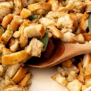 Close-up of classic Thanksgiving stuffing showing toasted bread cubes and tender vegetables.