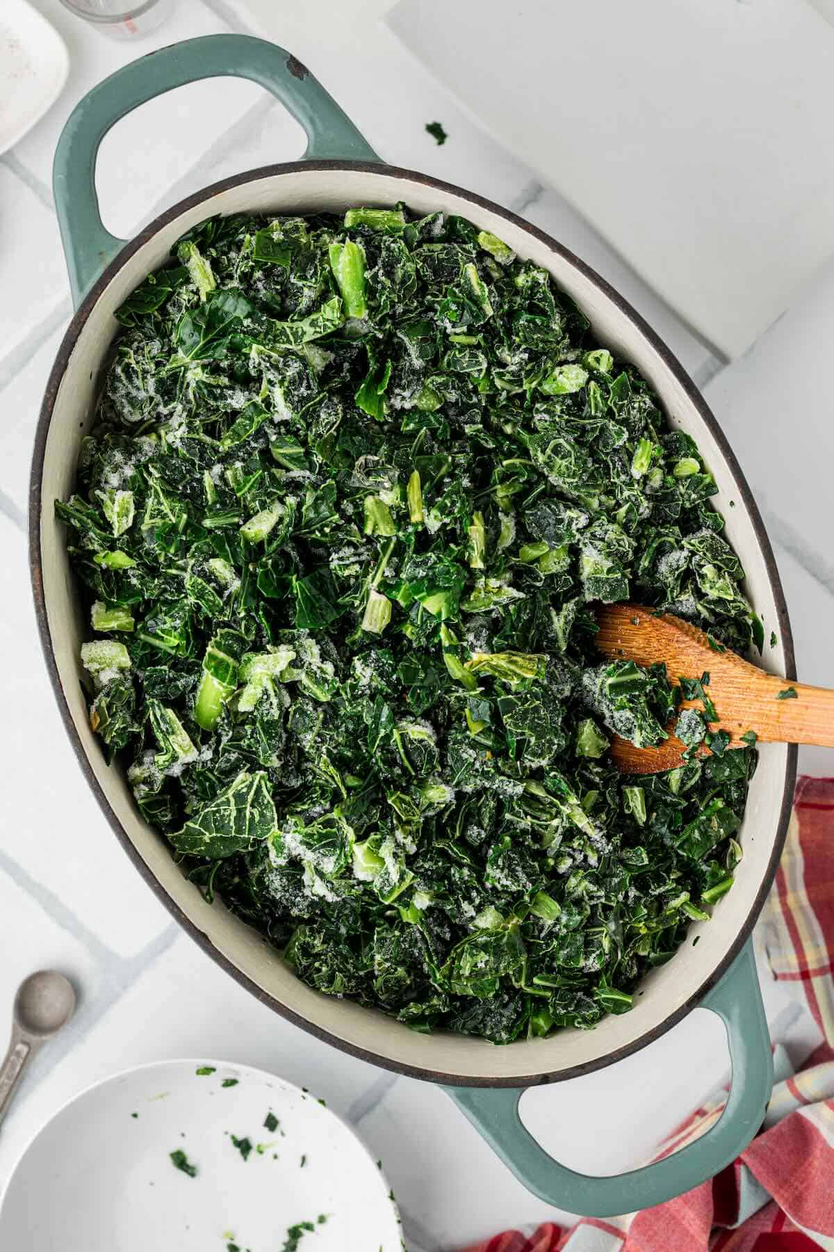 Frozen collard greens piled into the pot over ham hocks before adding remaining water.