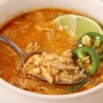 Spoonful of Mexican street corn soup showing tender chicken, fire-roasted corn, and rich broth.