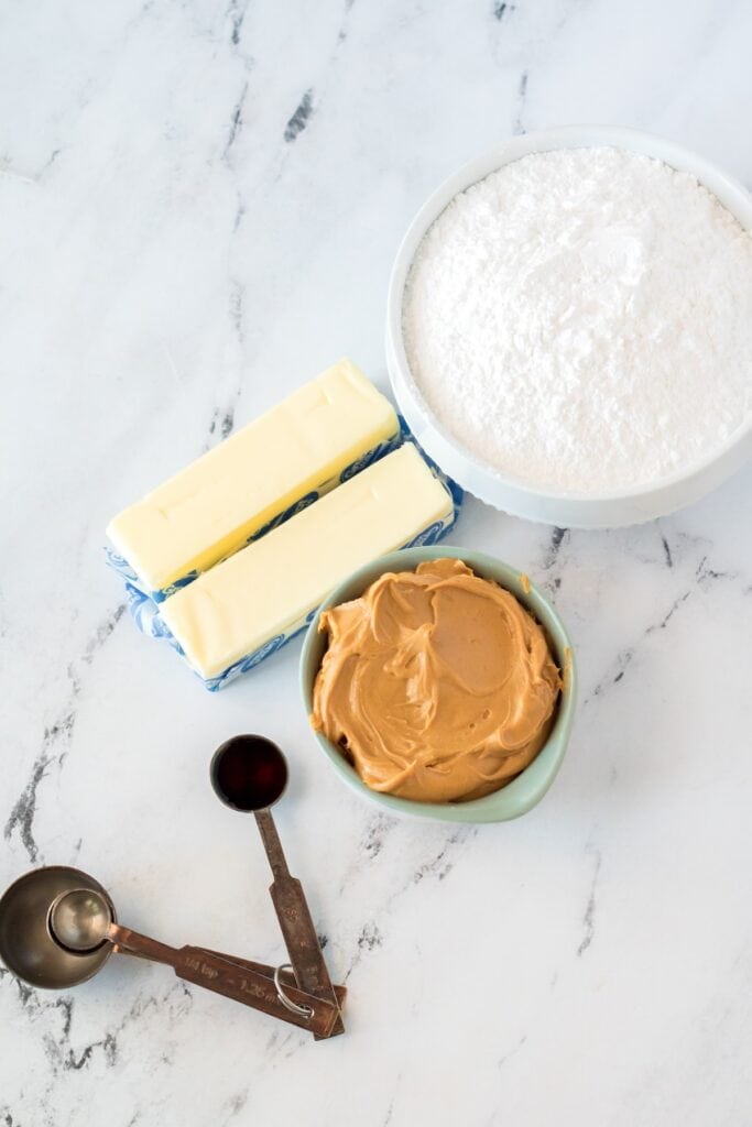 Peanut butter, butter, powdered sugar and vanilla extract to make an easy fudge recipe.