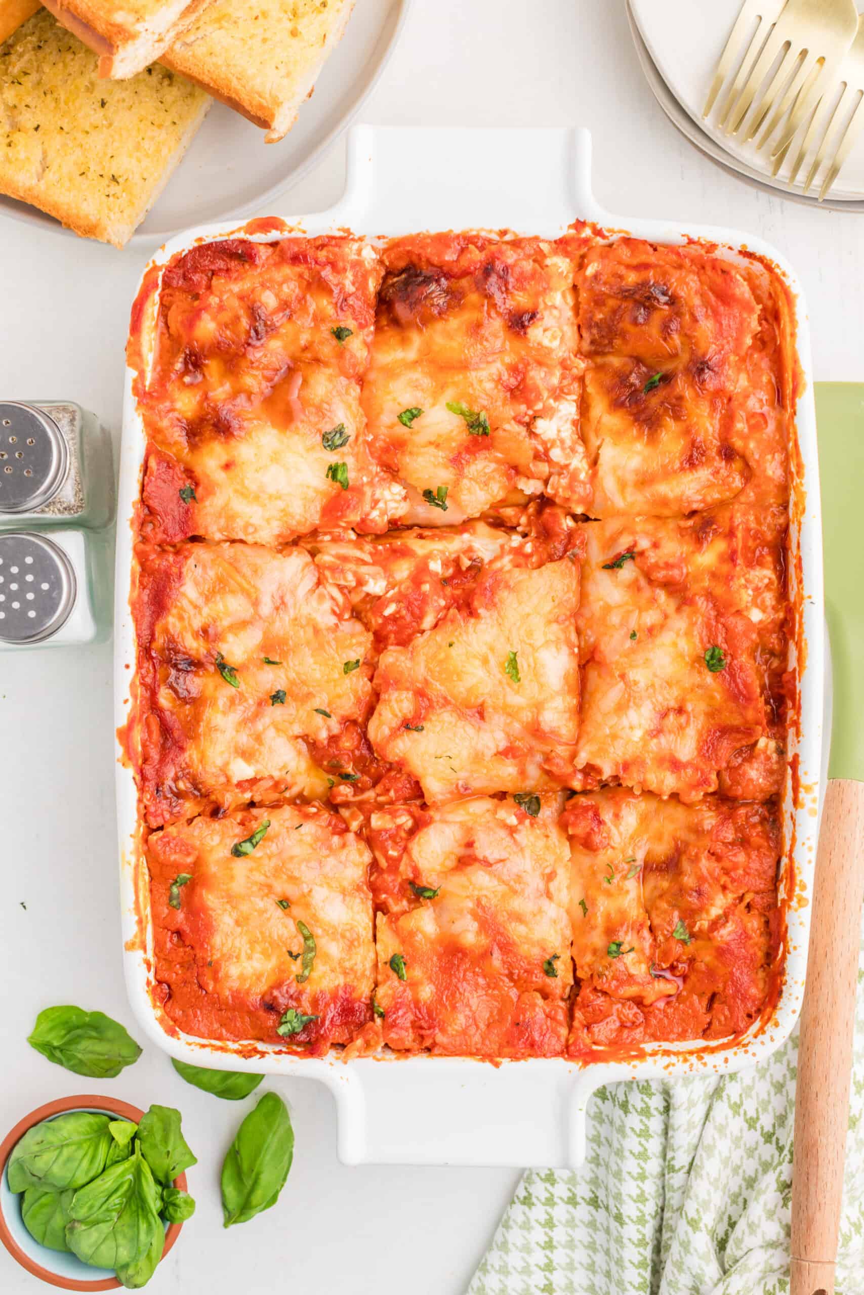 Lazy lasagna after baking, having rested and sprinkled with fresh basil.