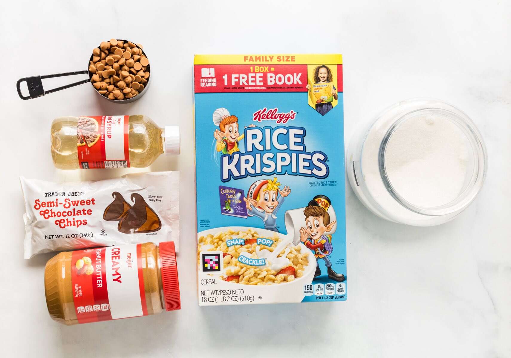 Crispy rice cereal, peanut butter, corn syrup, sugar, chocolate chips and butterscotch chips to make no bake scotcharoo s.