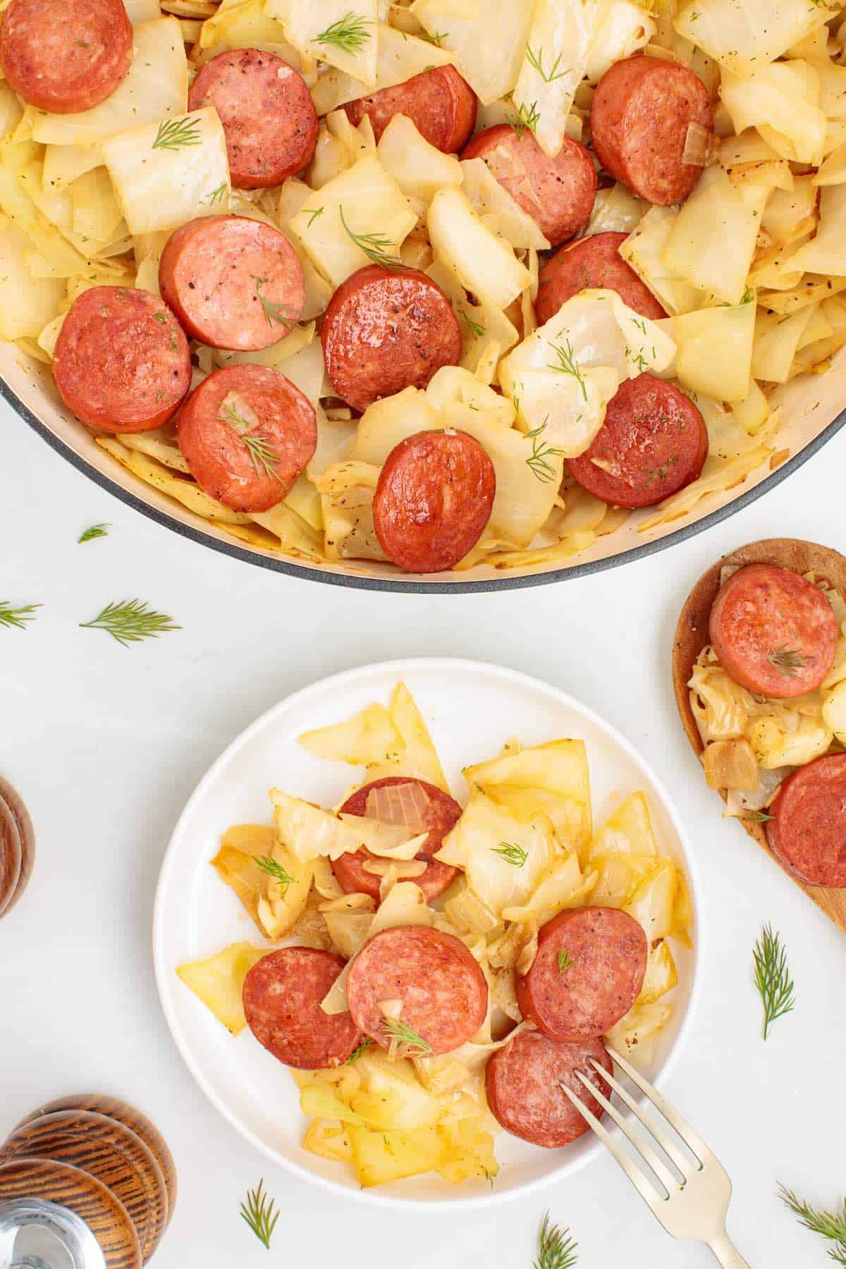An easy weeknight dinner with sausage and cabbage, plated and ready to eat.