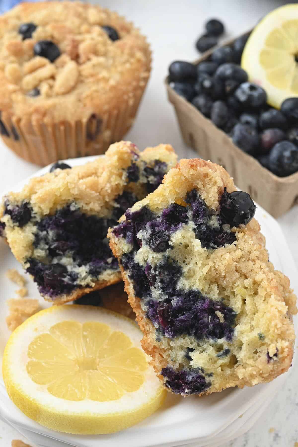 Inside of a bakery style blueberry muffin showing a soft, moist crumb.