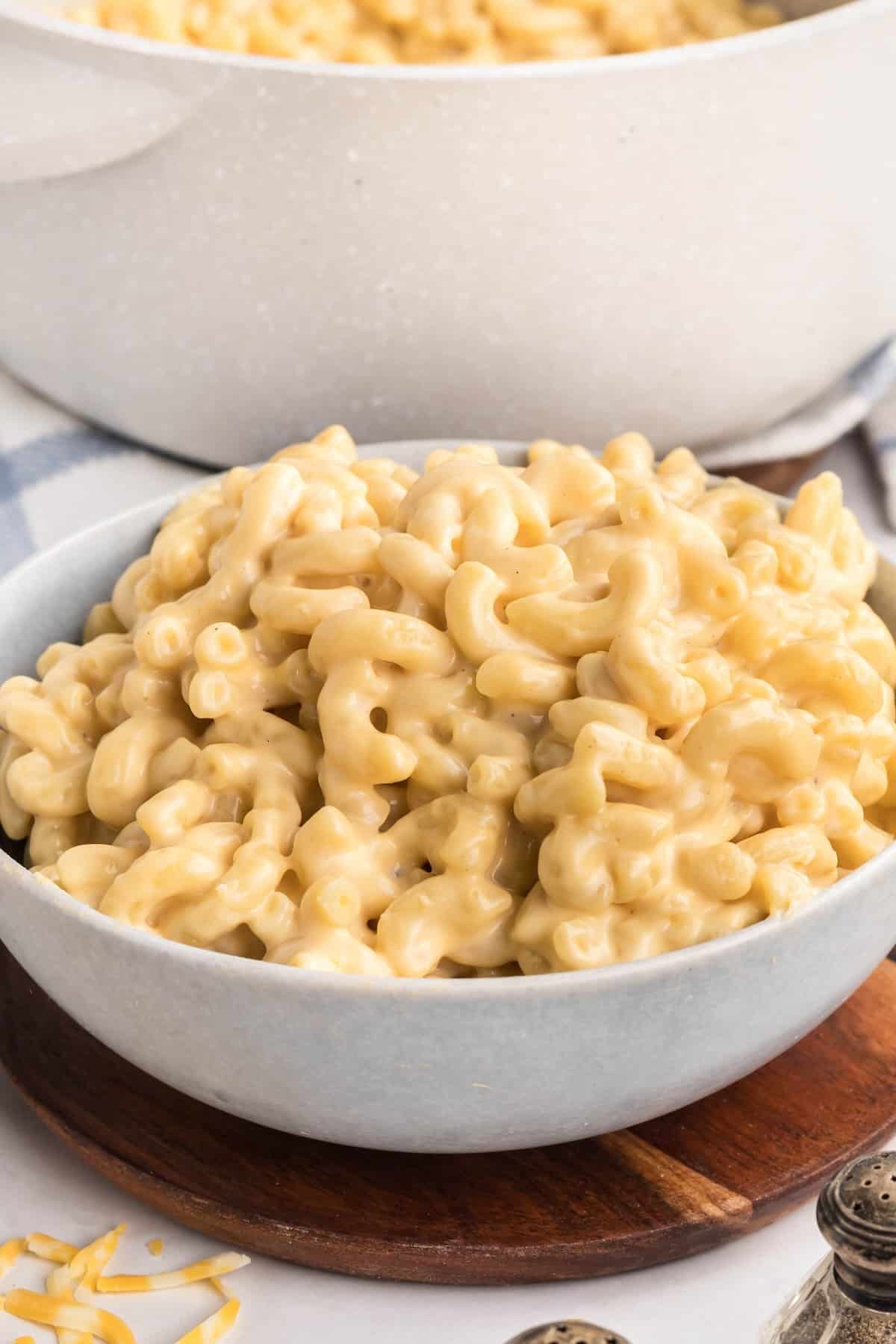 Close up of extra creamy mac and cheese served in a gray bowl.