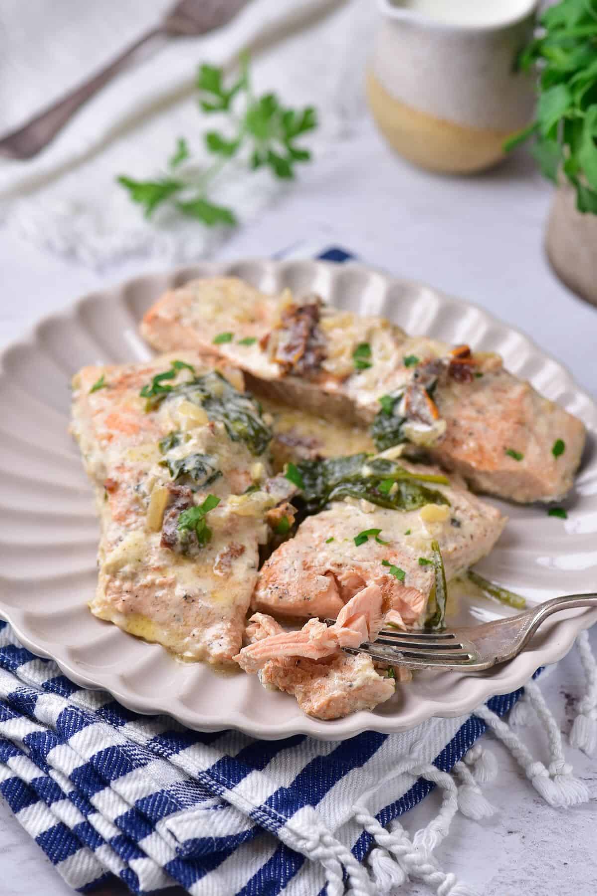 Flaky salmon coated in creamy garlic parmesan sauce.