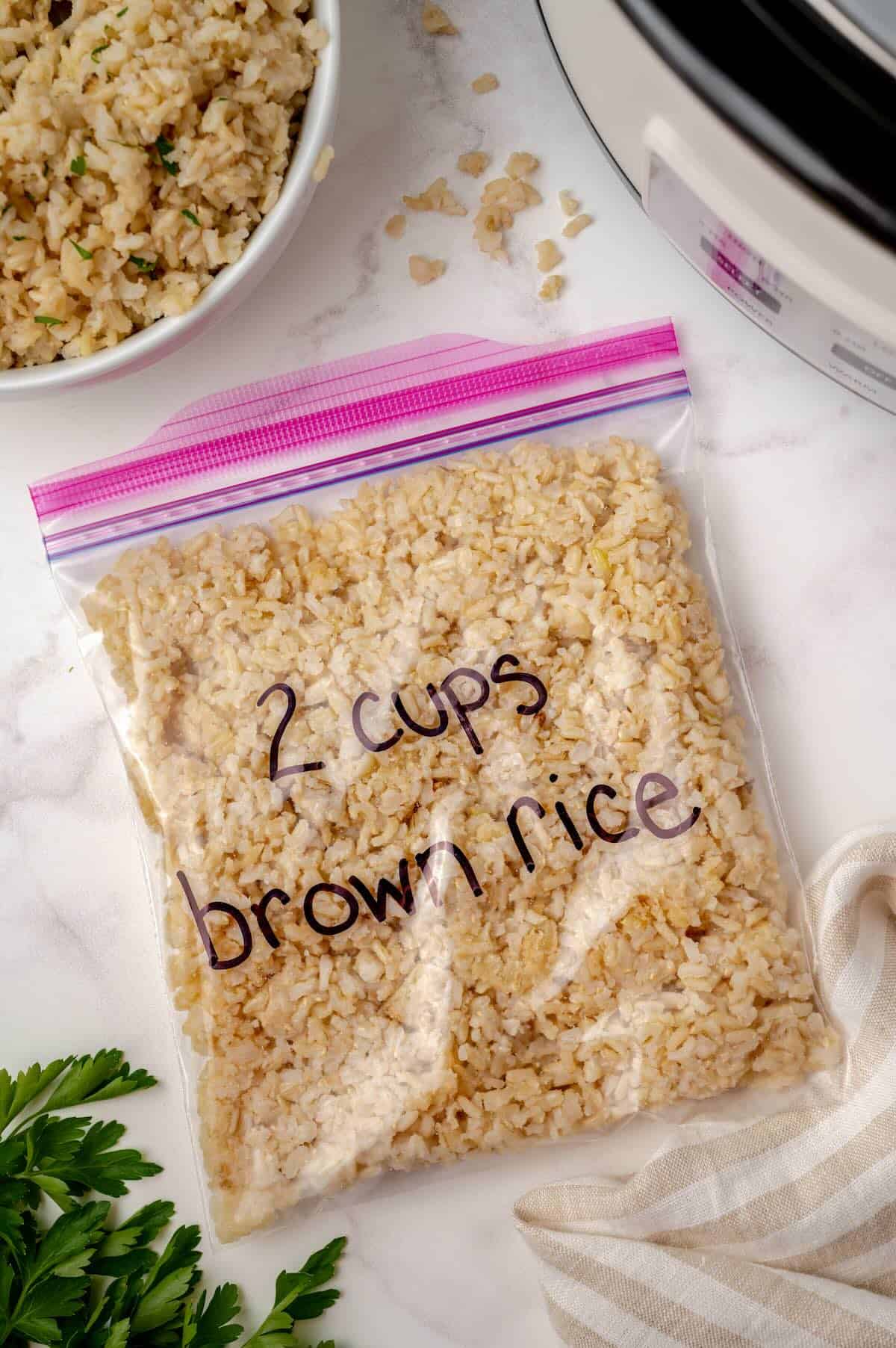 Cooked brown rice stored in freezer bag.