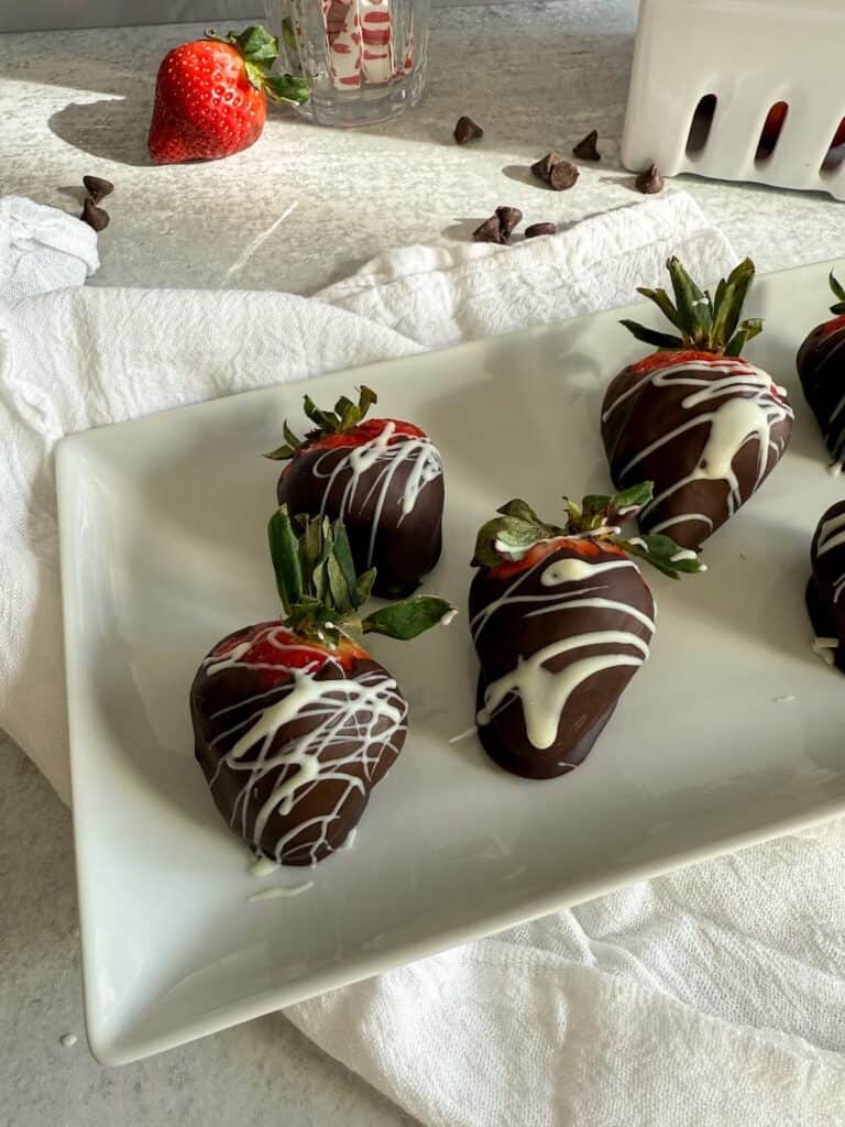 Chocolate covered strawberries made in the microwave and drizzled with white chocolate.