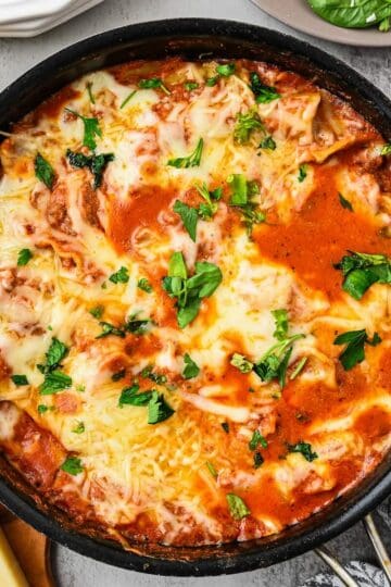 Saucy noodles, melty cheese, browned ground beef and lasagna noodles cooked in a skillet.