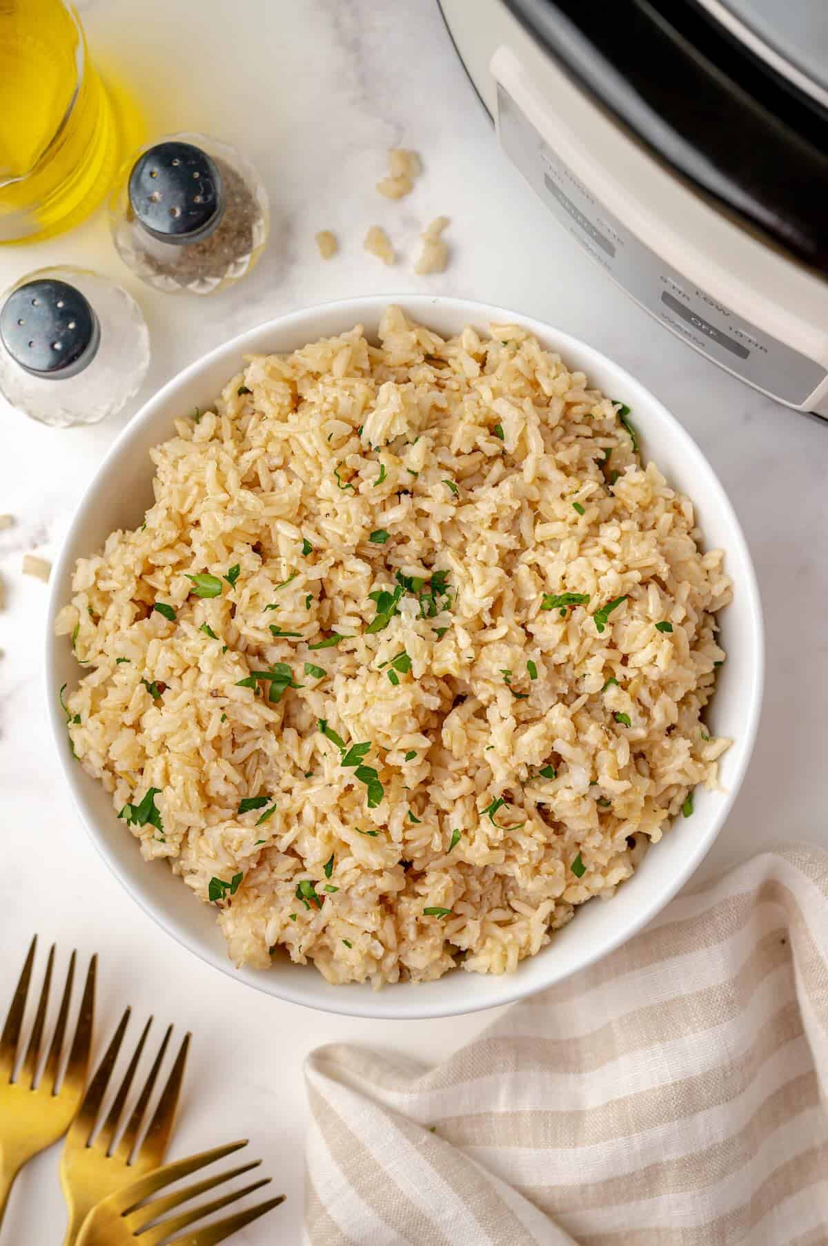 Cooked brown rice in bowl made in the slow cooker.