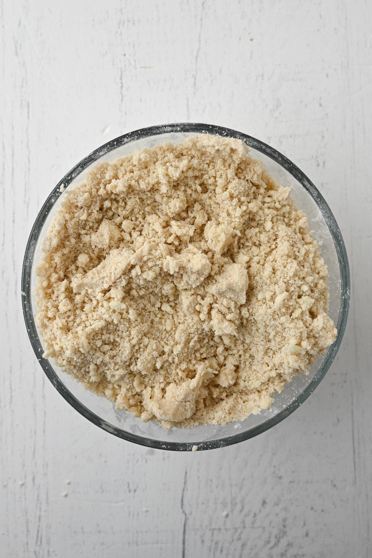 Buttery streusel topping mixed for bakery style blueberry muffins.