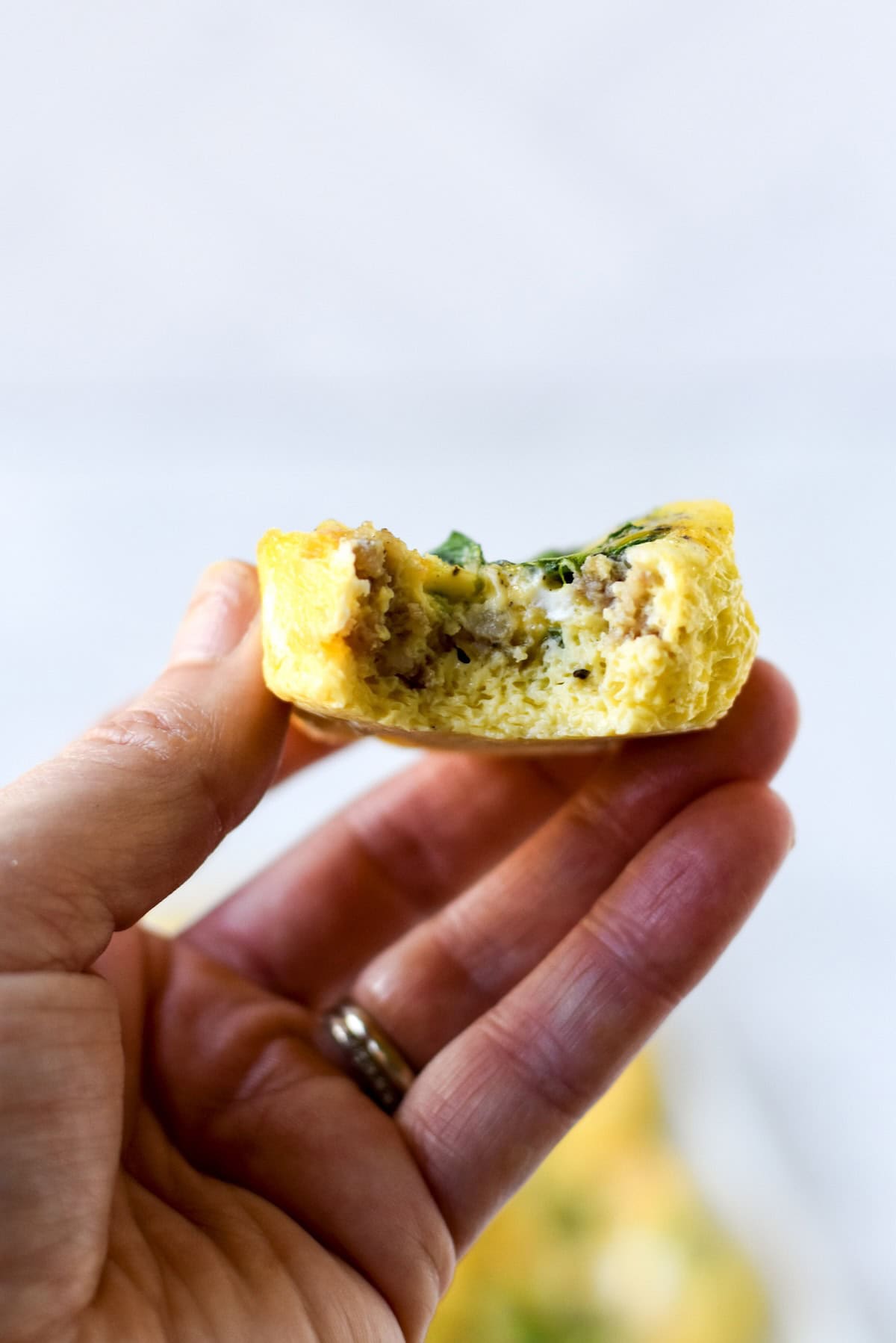 Inside texture of egg muffins baked with vegetables and sausage.