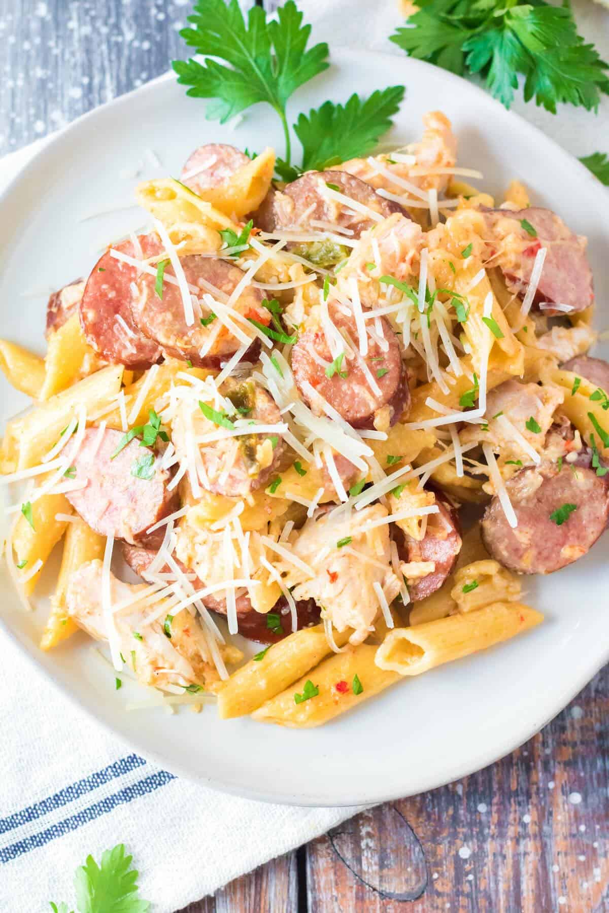 Creamy Cajun chicken pasta made with penne pasta, andouille sausage and parmesan cheese.