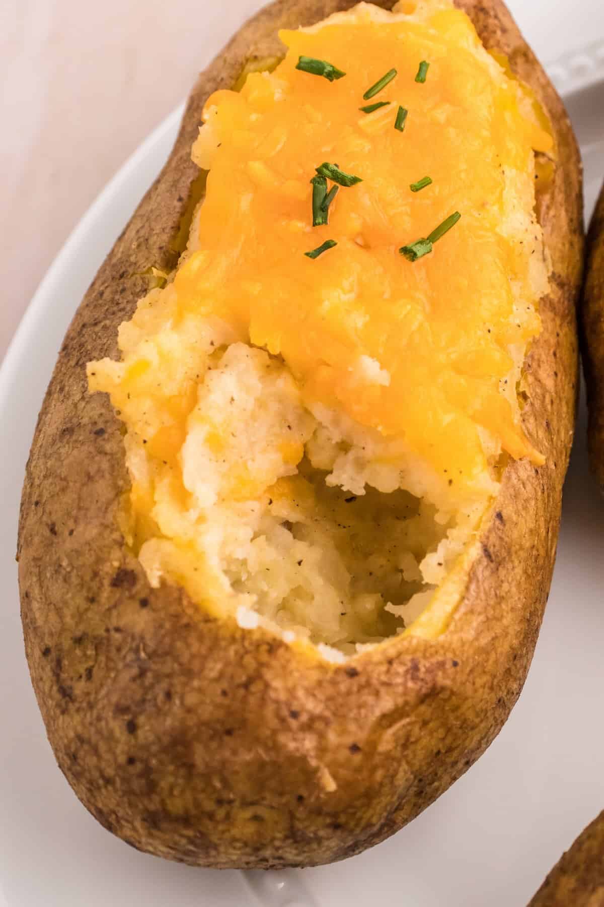 Fluffy inside texture of a twice baked potato with creamy mashed potato filling.