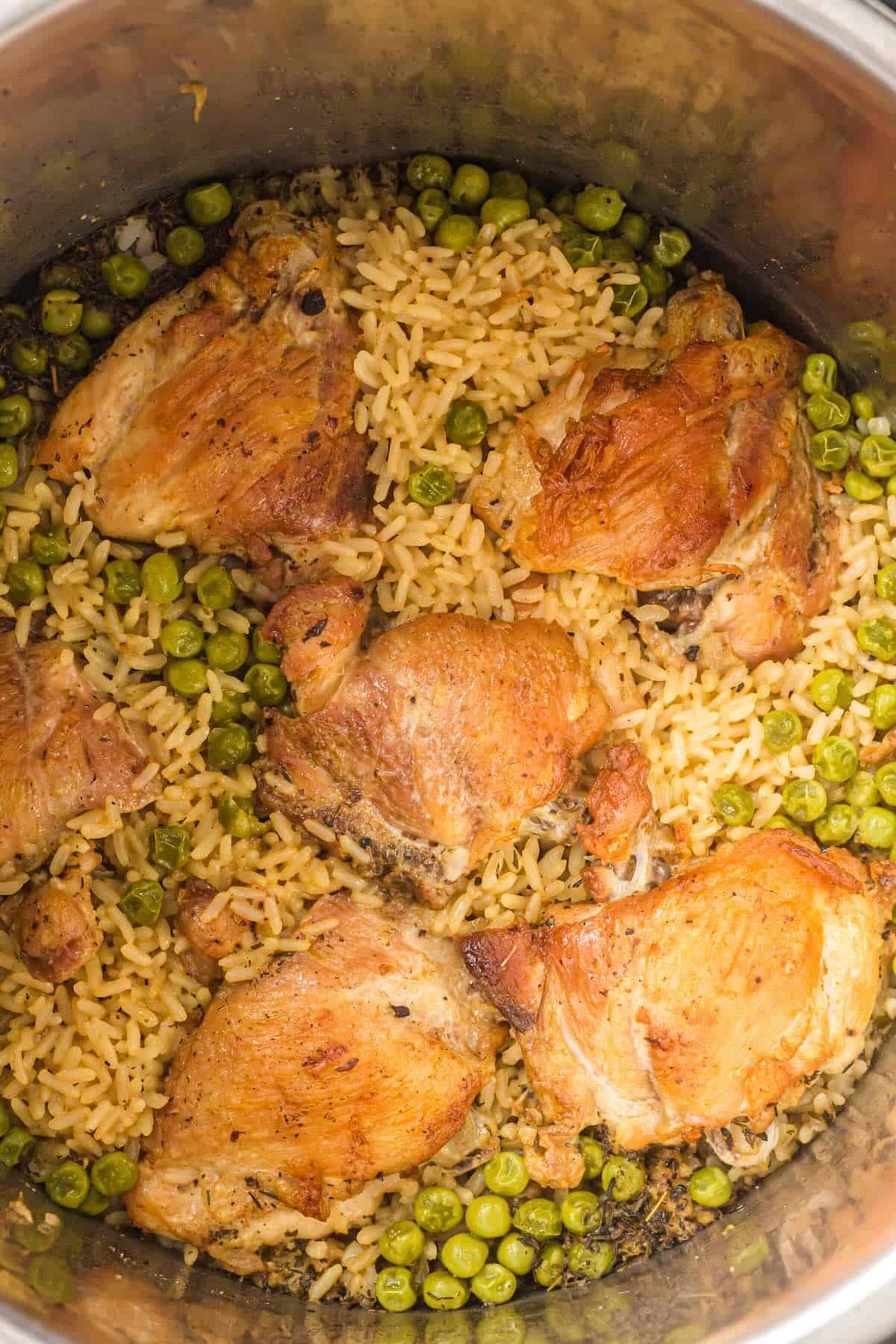 Easy Instant Pot chicken and rice recipe with chicken thighs and frozen vegetables.