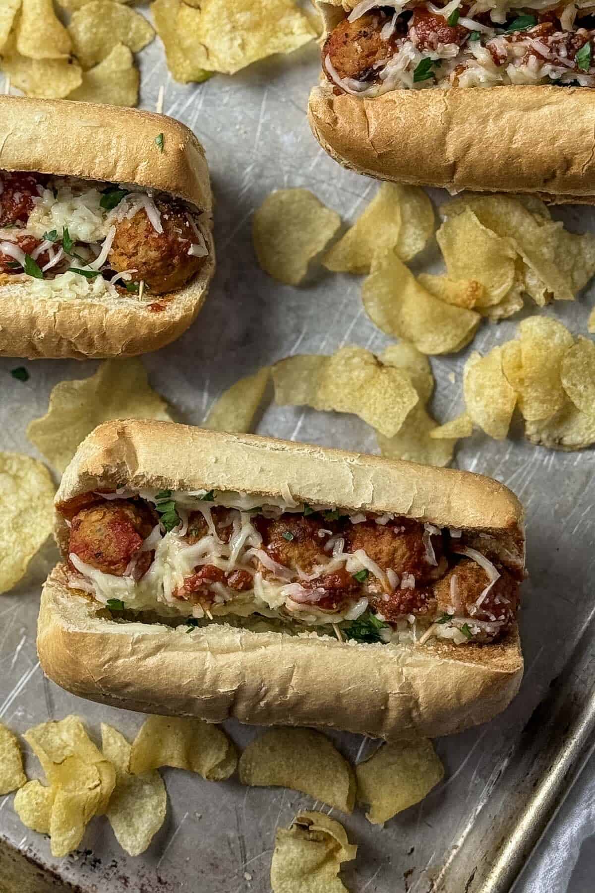 Easy meatball subs using frozen meatballs with marinara sauce and melted mozzarella on toasted hoagie rolls.