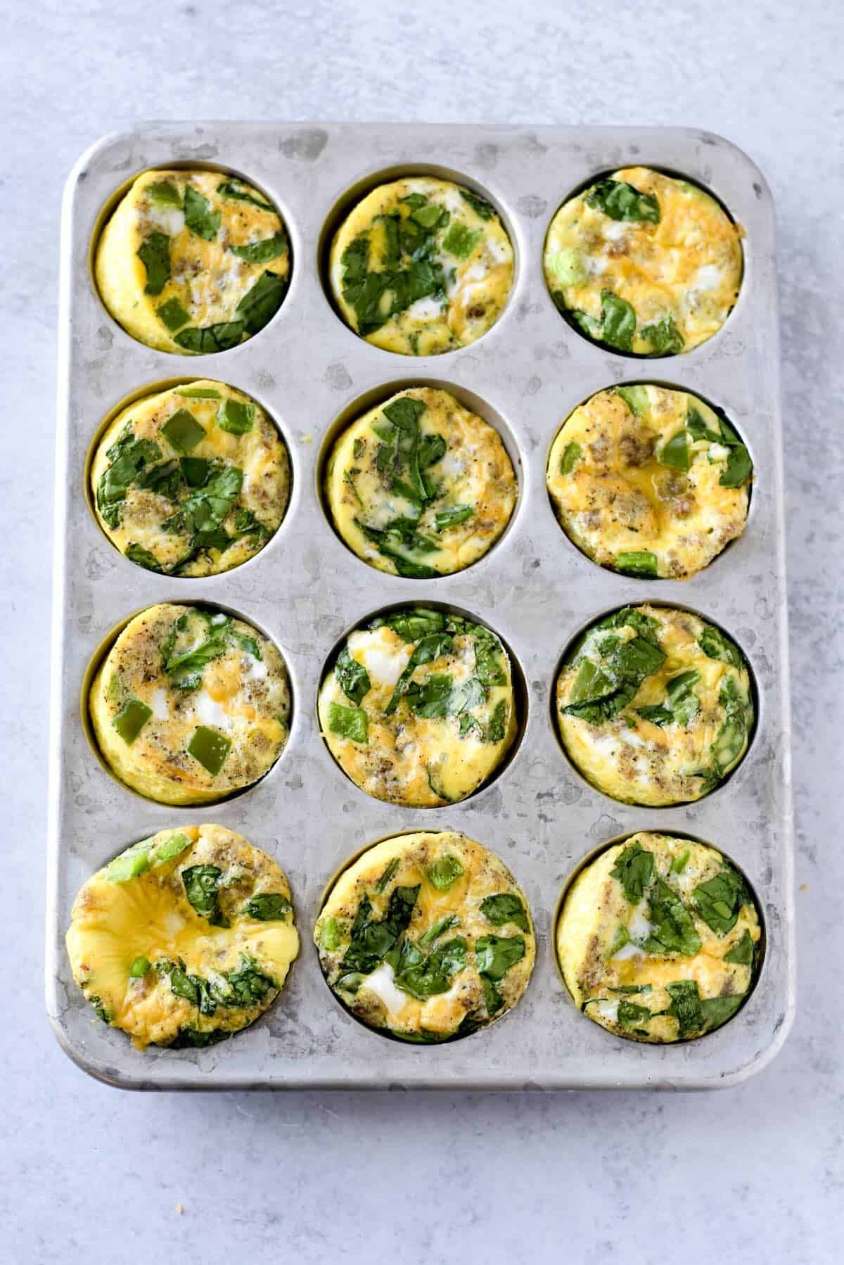Crustless quiche muffins made with eggs, sausage, cheese and vegetables.