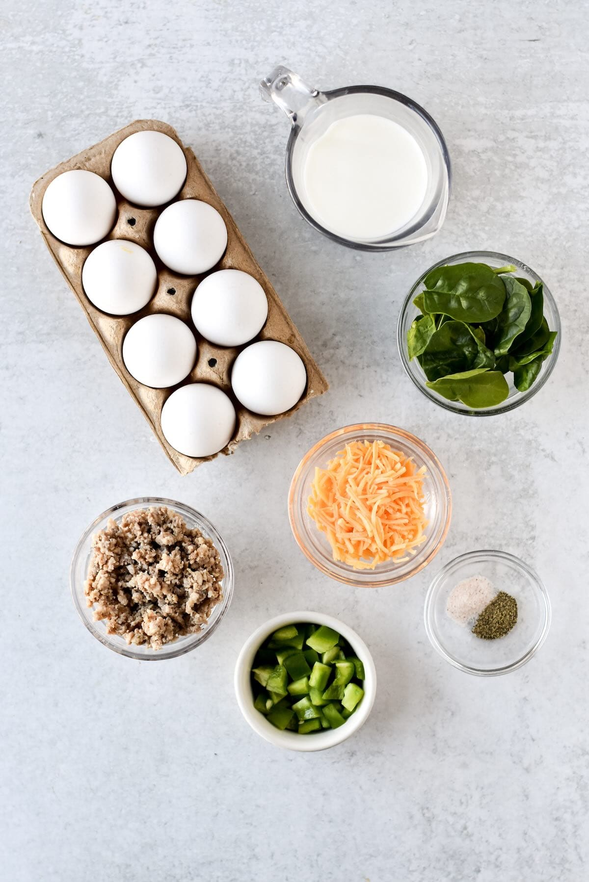 Eggs, milk, cheese, sausage and veggies to make mini crustless quiche in muffin cups.