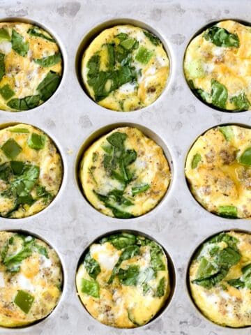 Mini crustless quiche with sausage and vegetables made in a muffin tin.