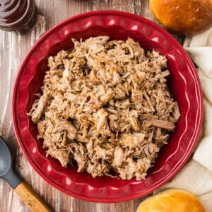 Slow cooker pulled pork in a dish.