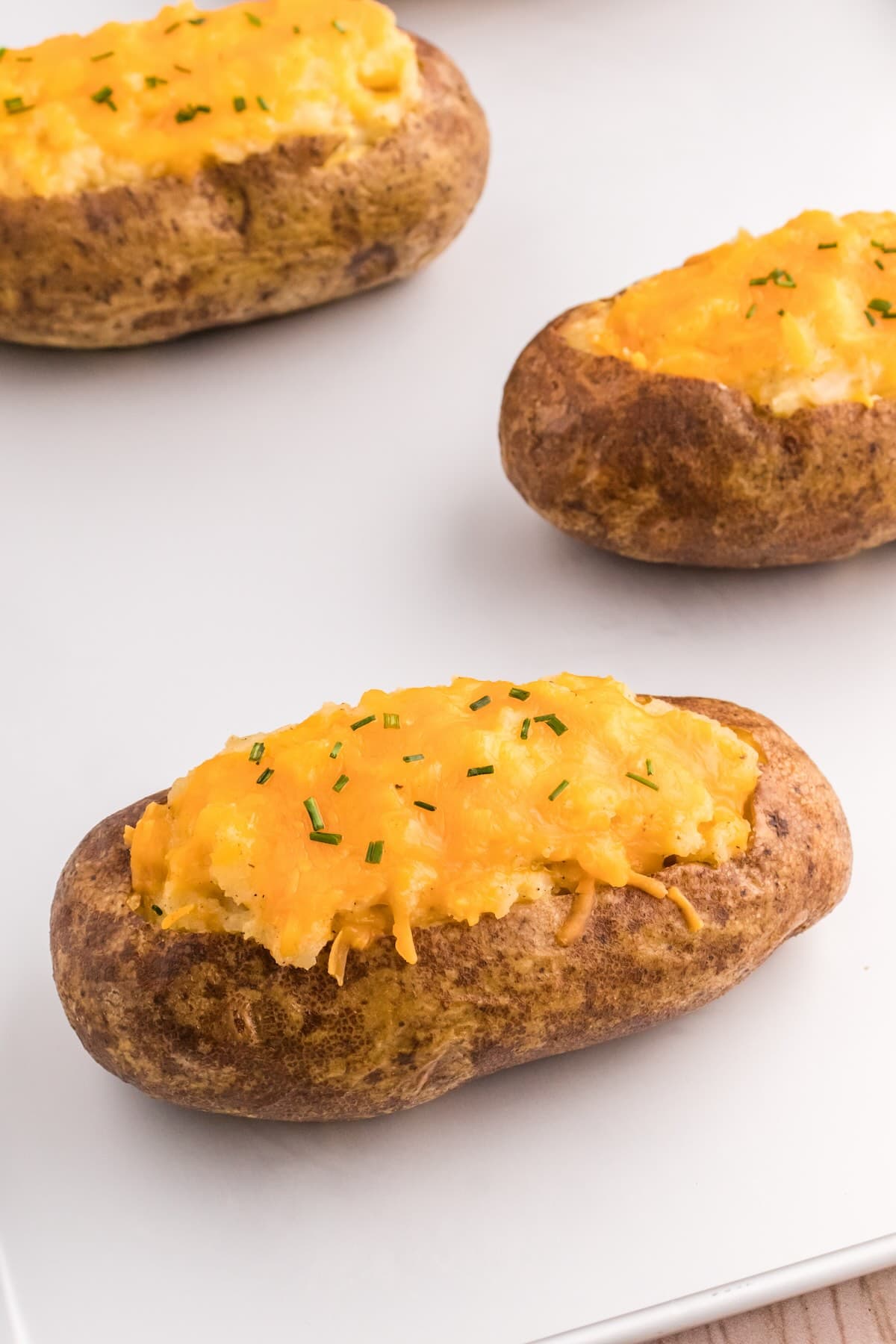 Classic twice baked potatoes with cheddar cheese and chives.