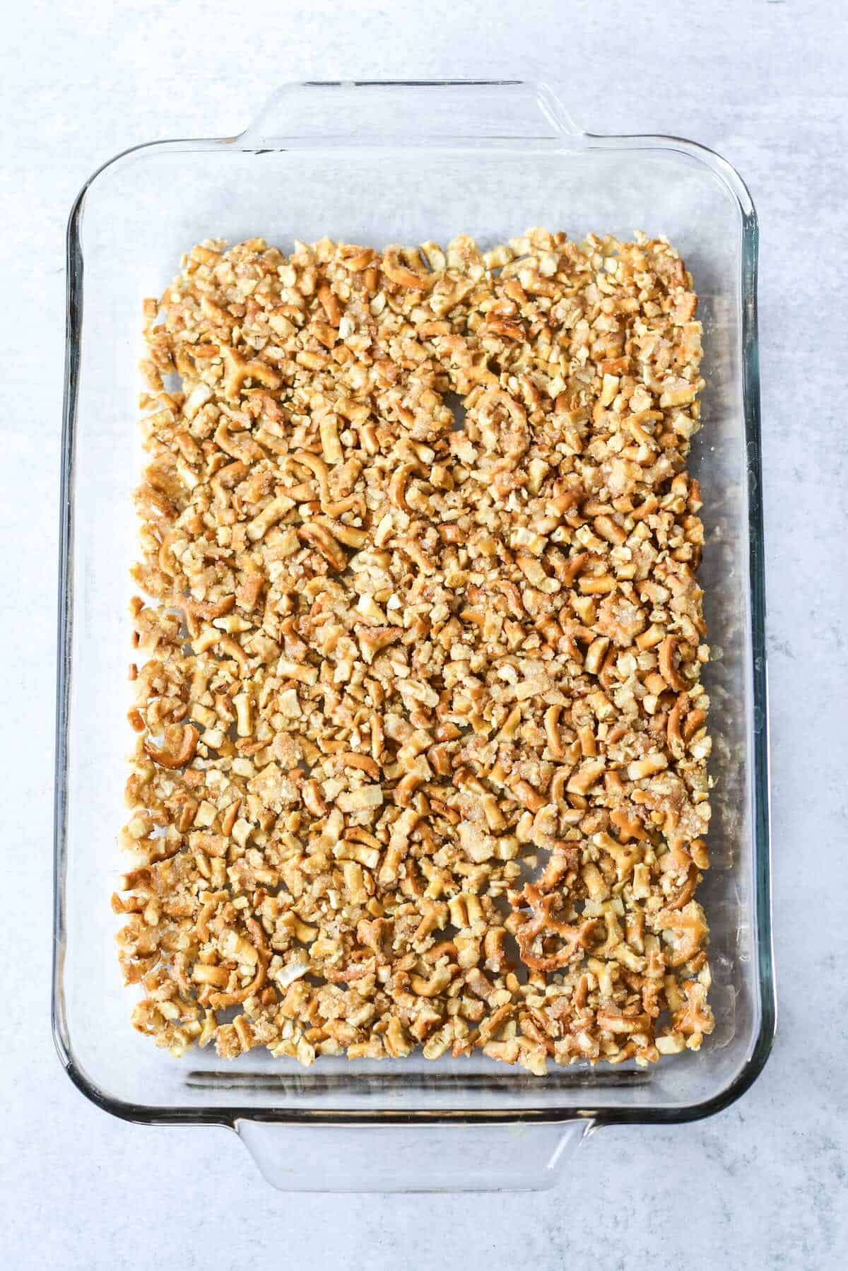 Baked pretzel crust in a 9x13 pan for strawberry pretzel salad recipe.