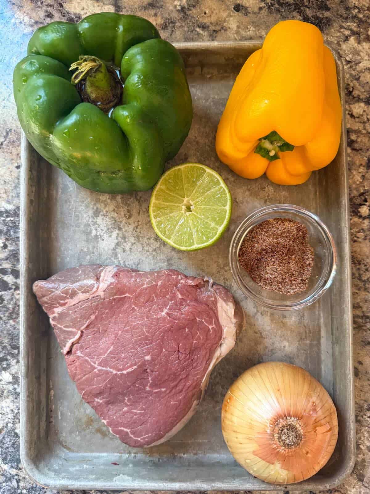 Ingredients to make beef fajitas in the oven.