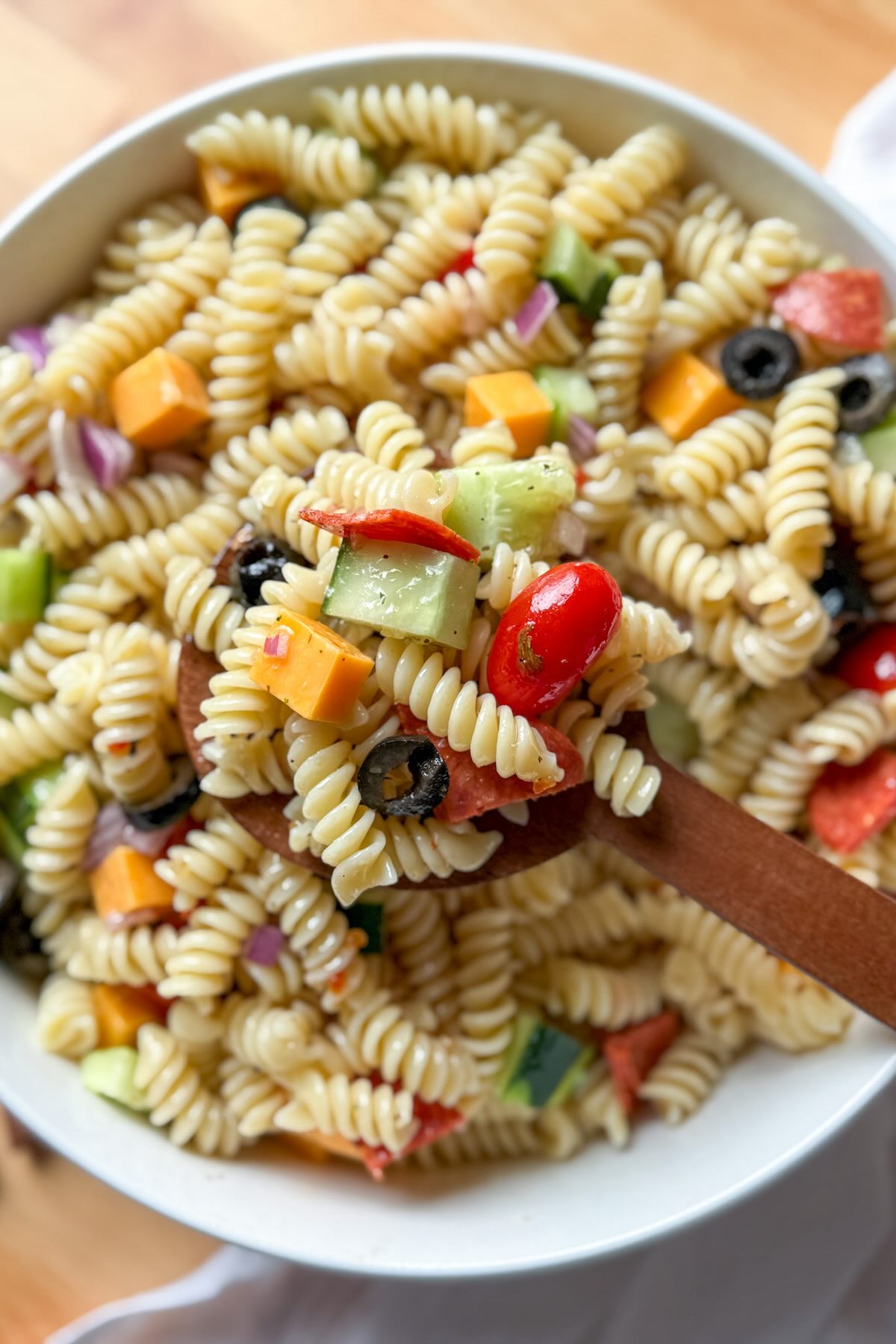 Classic Italian pasta salad ready to serve as a cold side dish for potlucks and BBQs.