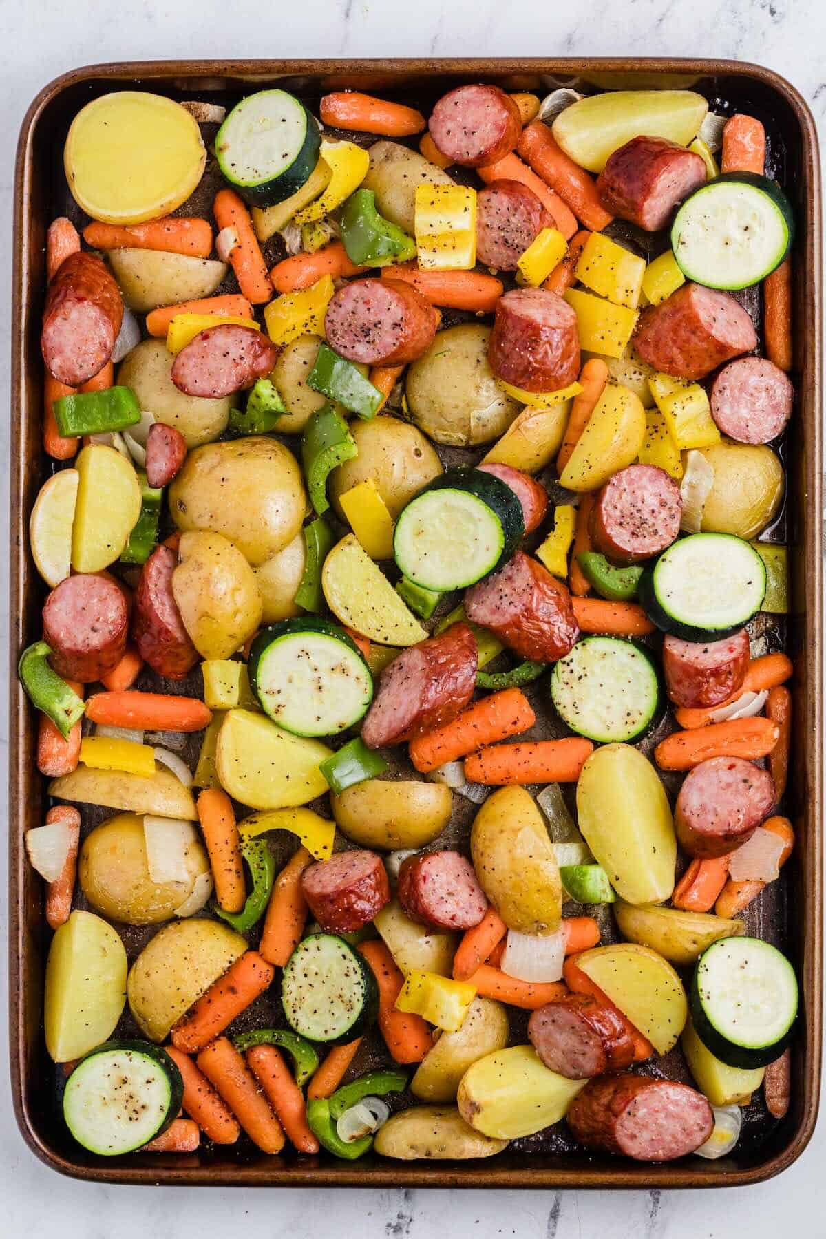 Sheet pan kielbasa and veggies with roasted potatoes, peppers, and sausage.