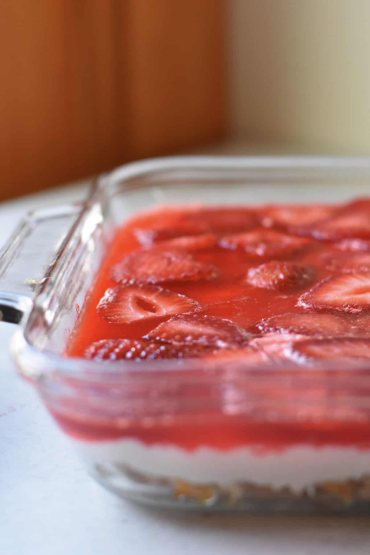 A side shot of the pretzels, cream cheese and strawberry jello mixture to make this midwest classic dessert.