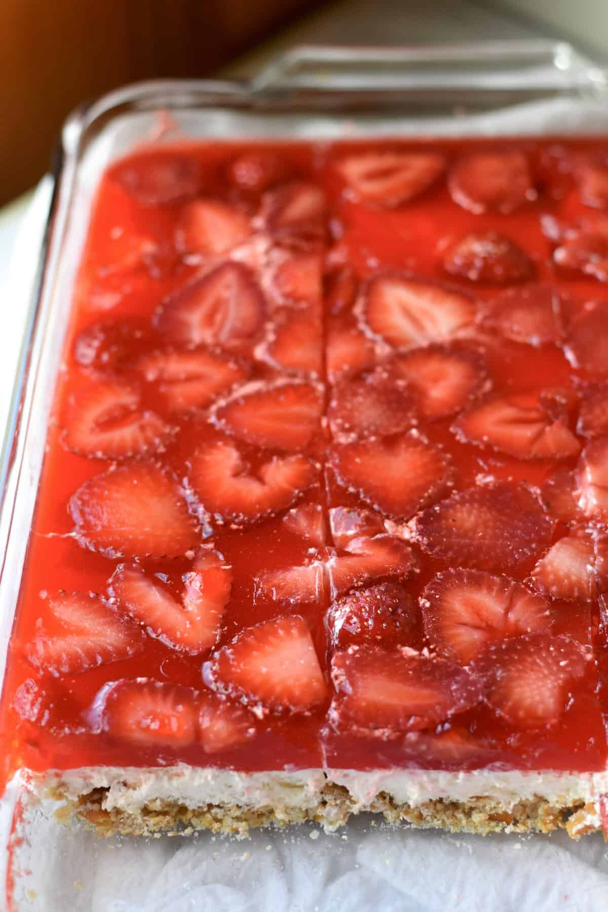 Strawberry pretzel salad set in a 9x13 dish ready to slice and serve.