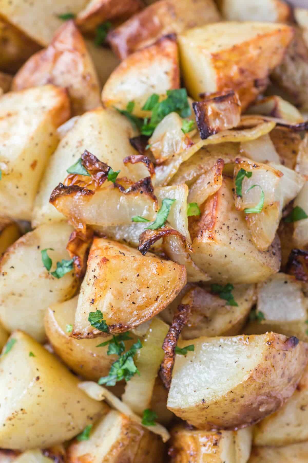 A heap of crispy air fried potatoes and onions, ready for breakfast.