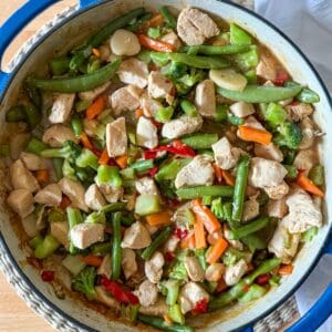 Easy chicken stir fry recipe with frozen vegetables and homemade sauce.