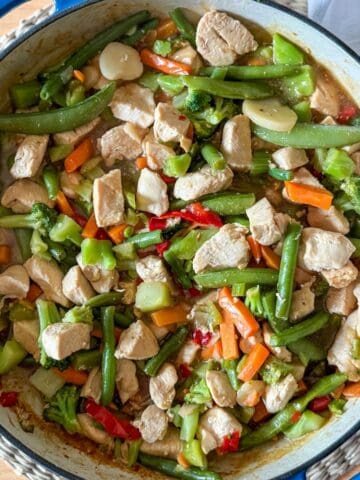 Easy chicken stir fry recipe with frozen vegetables and homemade sauce.