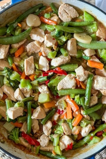 Easy chicken stir fry recipe with frozen vegetables and homemade sauce.