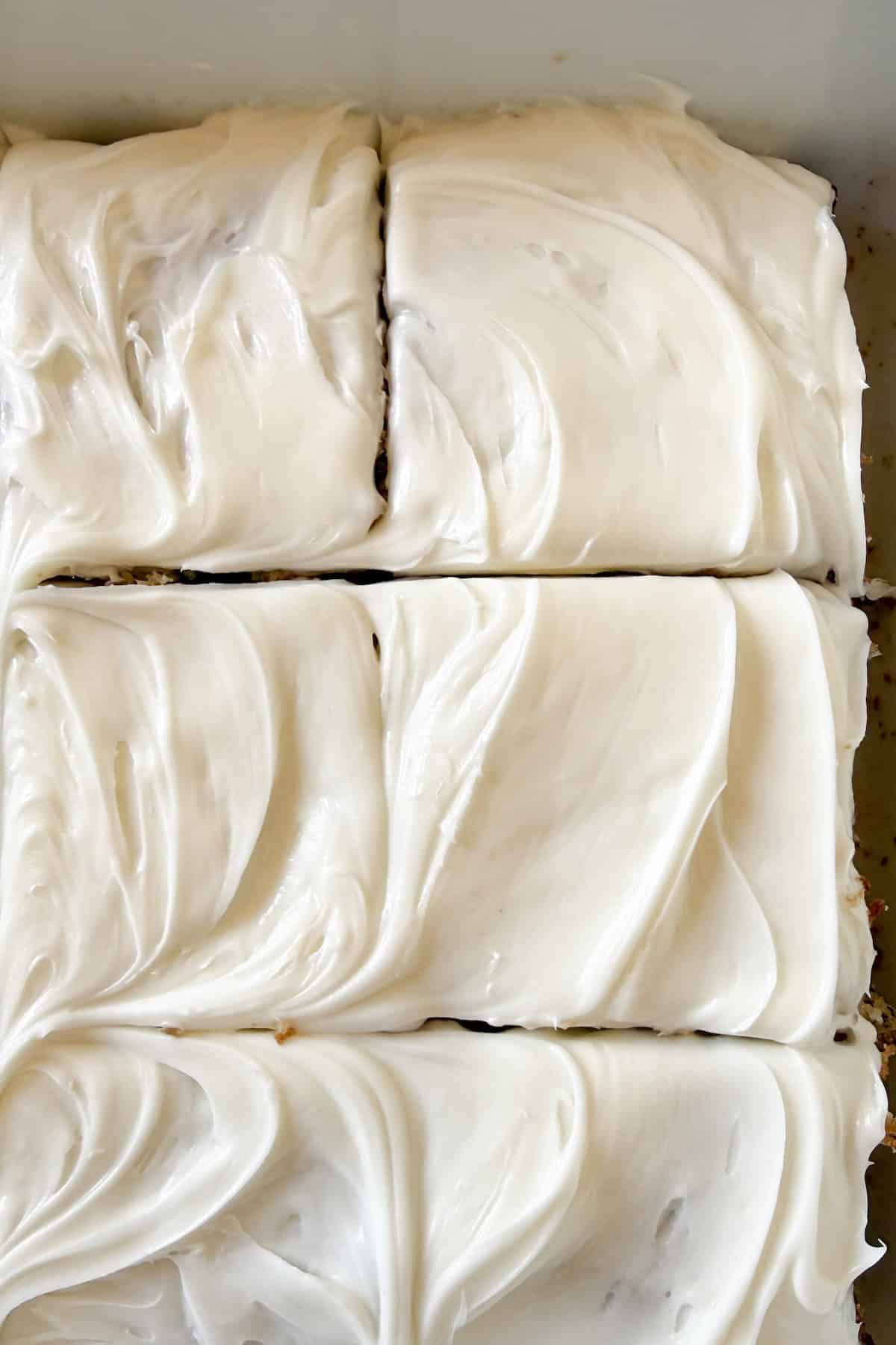 Frosted banana bars topped with cream cheese frosting.