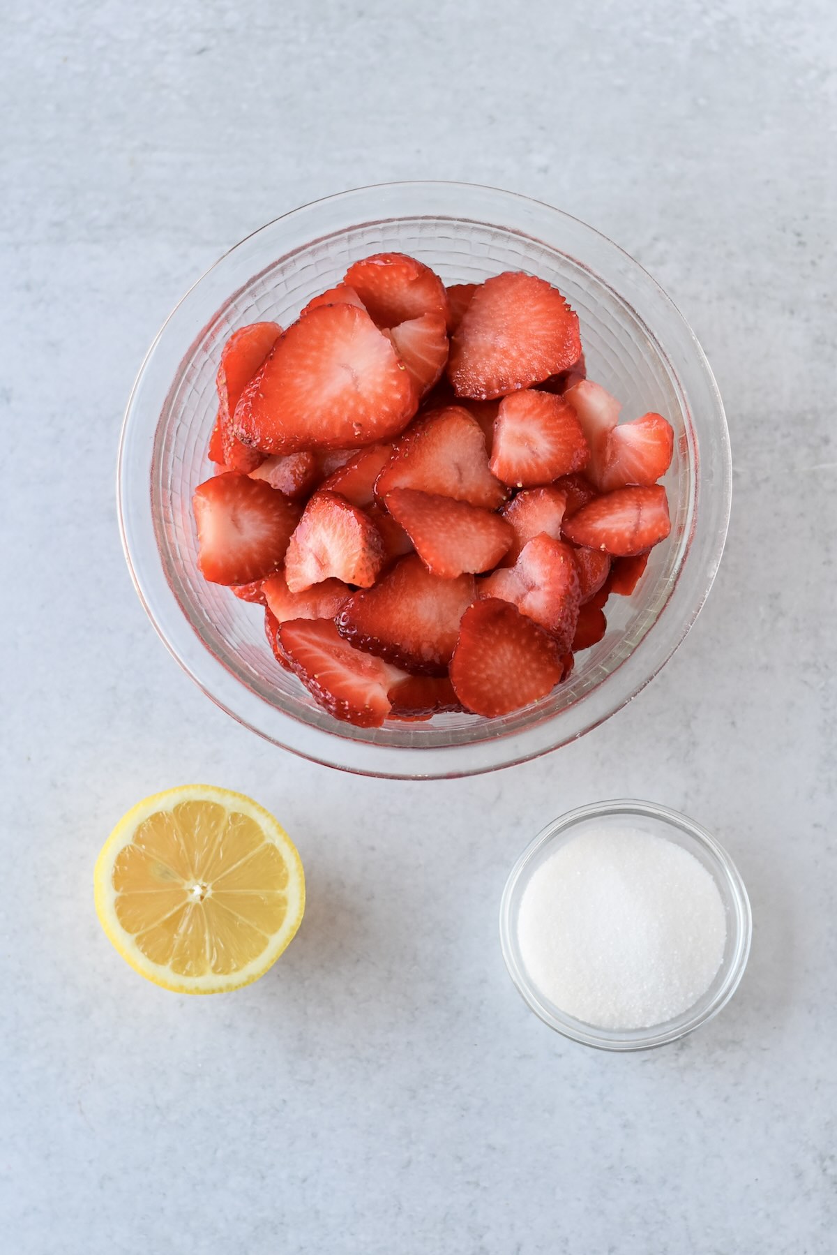Fresh sliced strawberries prepared for macerating.