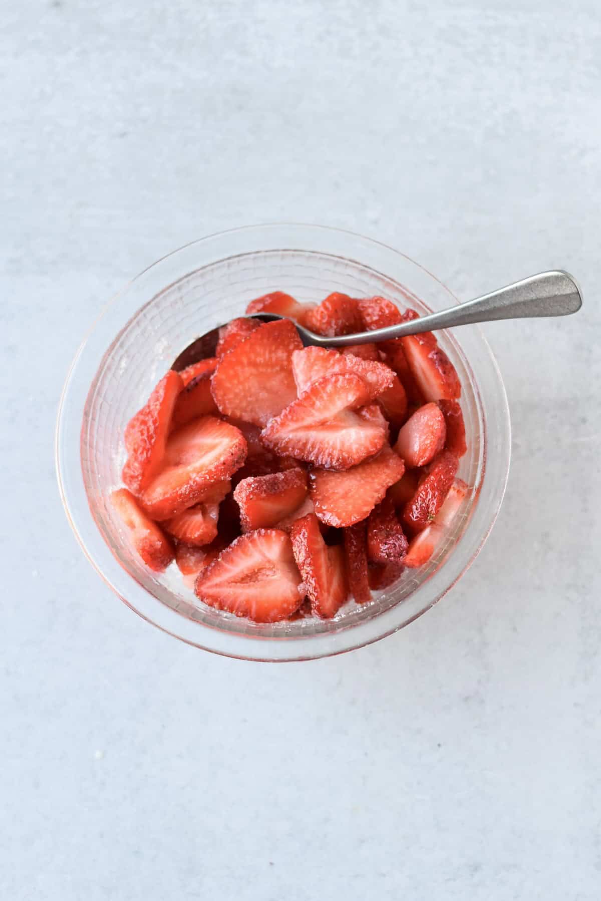 Strawberries releasing juices while making strawberry sauce.
