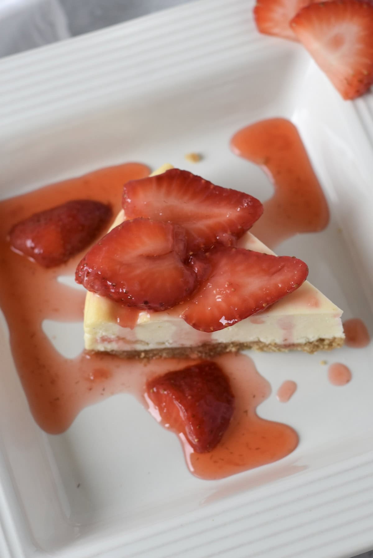 Strawberry sauce served over cheesecake.