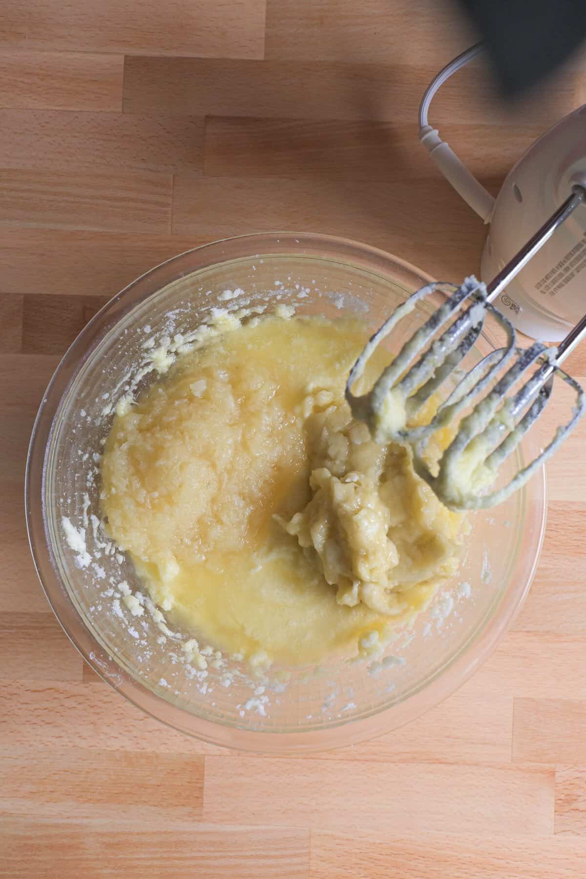 Mashed banana and crushed pineapple added to banana bread batter.