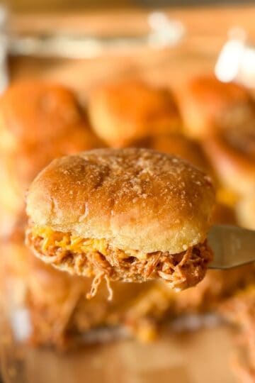 BBQ chicken sliders made with shredded chicken and melted cheese on slider buns.