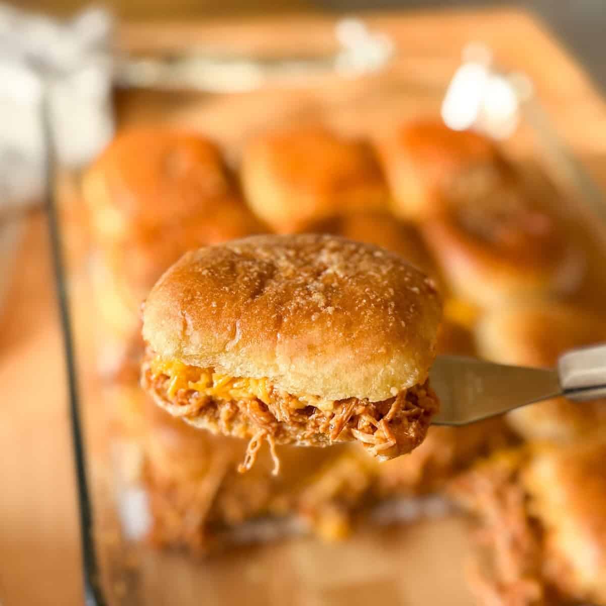 BBQ chicken sliders made with shredded chicken and melted cheese on slider buns.