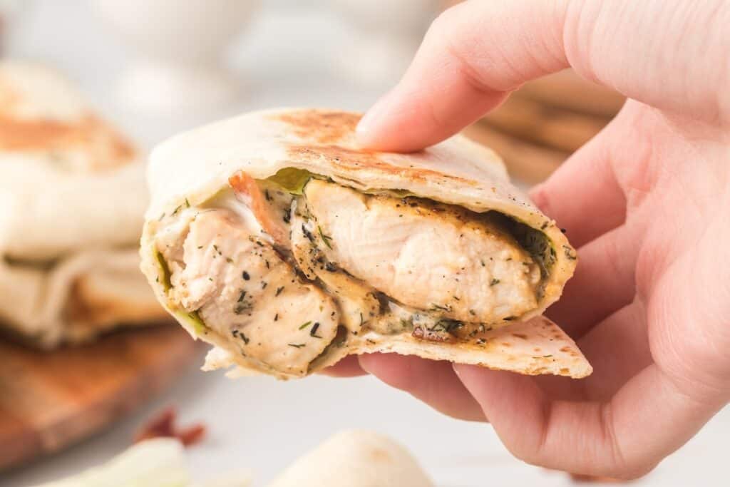 Chicken bacon ranch wraps filled with chicken, bacon, lettuce, and ranch dressing.