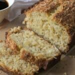 Moist Hawaiian banana bread topped with toasted coconut.