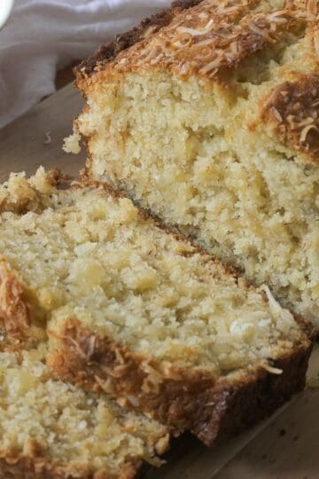 Moist Hawaiian banana bread topped with toasted coconut.